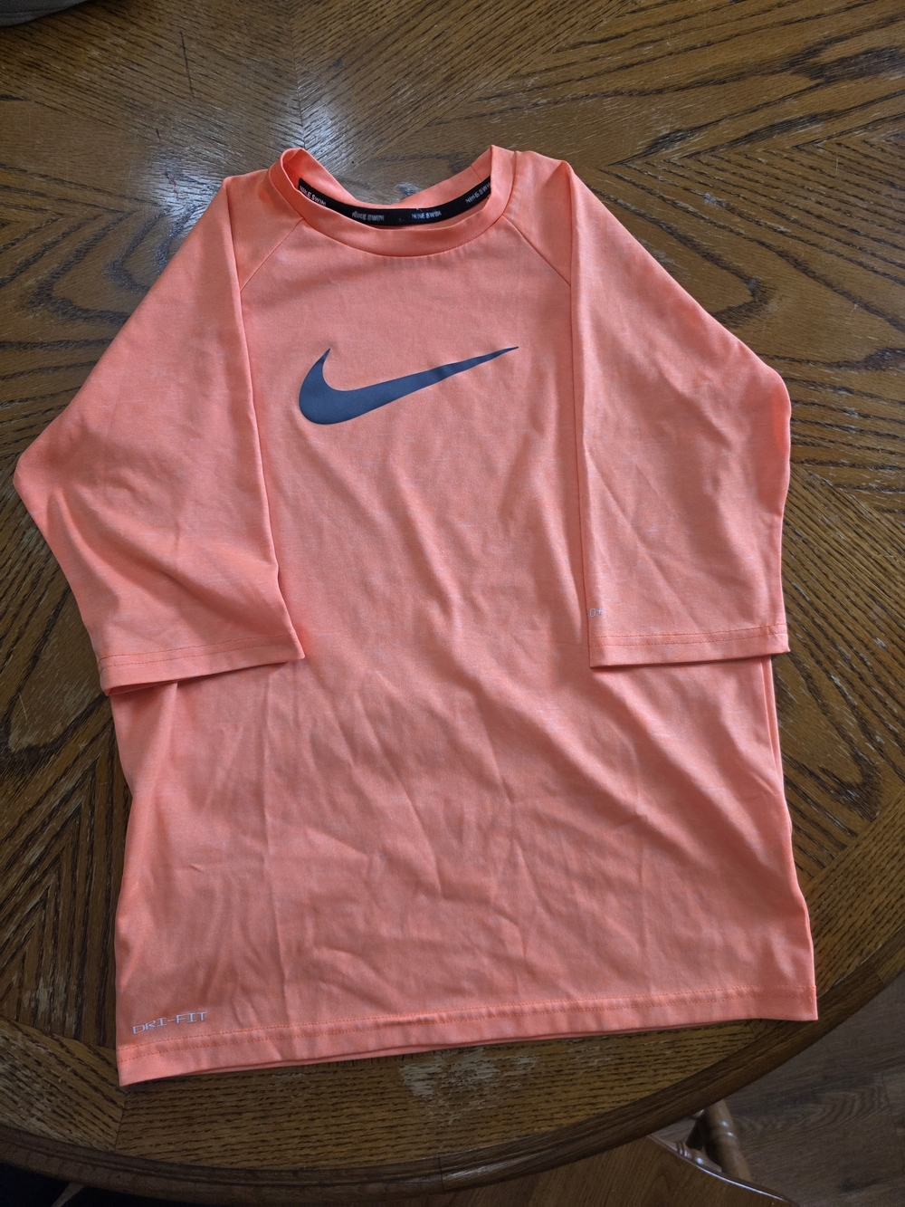Youth L Nike Coral/Peach Short Sleeve Athletic/Swim Tee with Swoosh